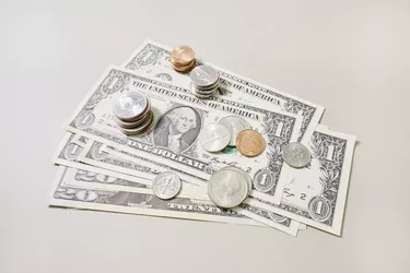 High angle view of American Dollar banknotes and coins