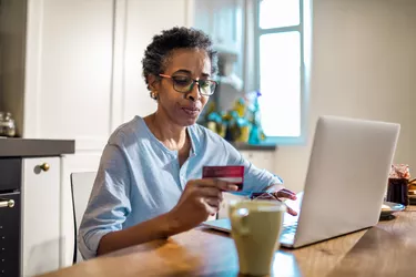 Senior woman online shopping on her laptop