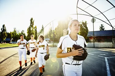 Softball teammates walking off of field