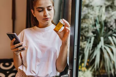 Young woman searching online about medicine