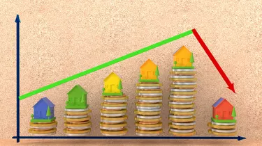 3d illustration. Houses on a pile of coins and graph with arrows - growth and drop