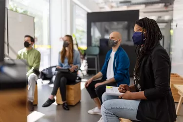 Business people having video conference meeting during pandemic