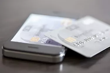 Credit card resting on smartphone