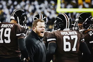 Football coach yelling at players during timeout