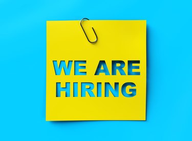 "We are hiring" yellow banner on blue textured background