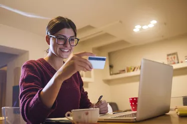 young woman using her laptop and shopping