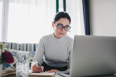 Young Woman Doing Finances at Home