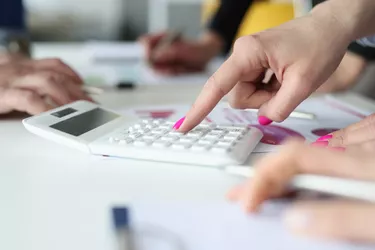 Female accountant busy with counting