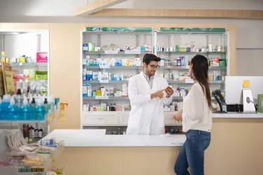 Pharmacy customer asks pharmacist question about medication