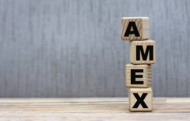 AMEX word on cubes on a beautiful gray background.