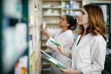 Pharmacists working together in a drugstore.