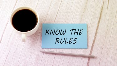 Know the Rules text on blue sticker with cofee and pen