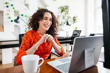 Transgender Woman Smiling While Video Calling Business Partner