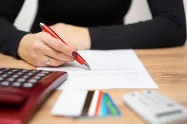 Woman reading notice about credit