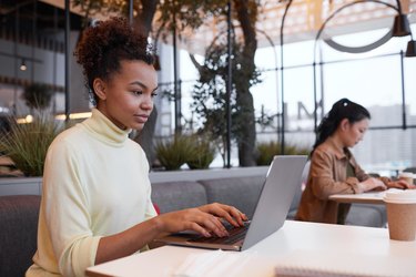 African American Young Woman Working in Cafe