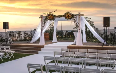 Chairs And Table Against Sky During Sunset