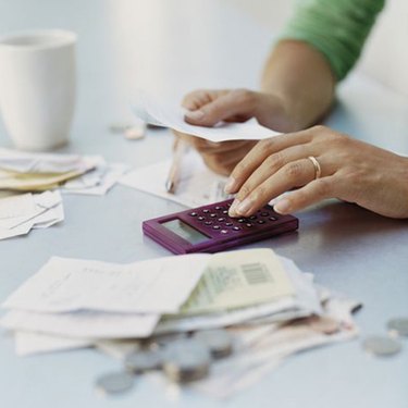 Woman Using a Calculator