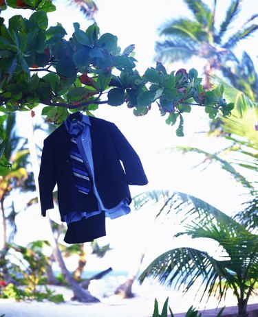 Three piece suit hanging in tropical trees