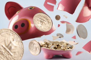 pink piggy bank being smashed