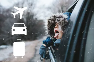 kid in a car in winter flurries