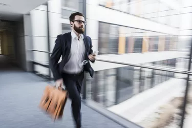 man in suit running