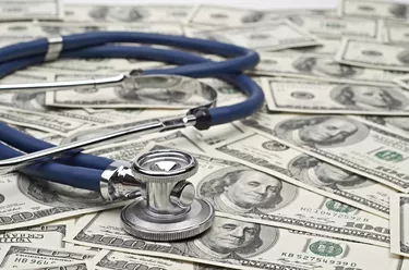 heap of dollars with stethoscope