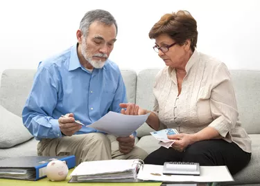 couple calculating home finances