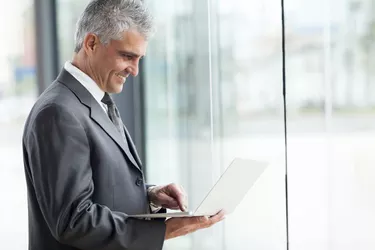 senior businessman working on laptop