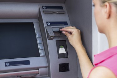 Young woman at the ATM
