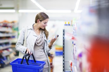 Beautiful young woman shopping in a grocery
