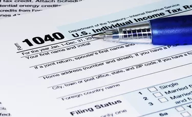 Tax Return Form with a Pen