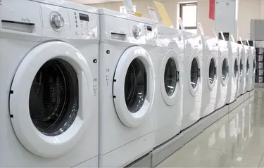 Rows of clothes washers in a store