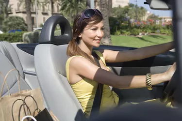 Woman driving convertible