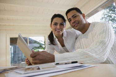 Couple smiling with a laptop