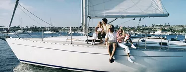 Family Couples Sitting on the Deck of a Sailing Yacht