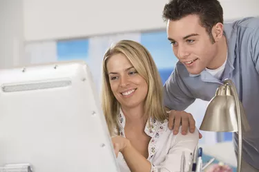 Smiling couple at computer