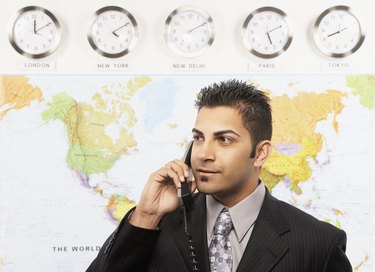 Indian businessman talking on telephone