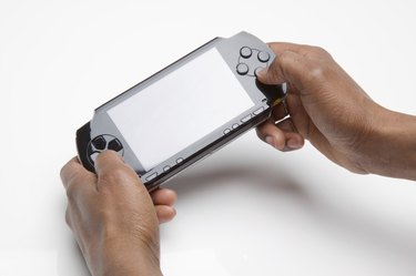 Hands holding portable video game