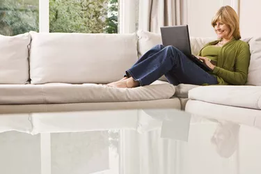 Woman reclining with laptop computer