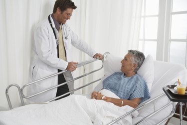 Patient in hospital bed speaking to Doctor