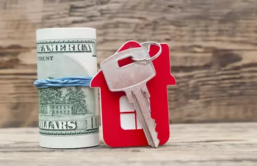 House keys over the hundred dollar banknotes