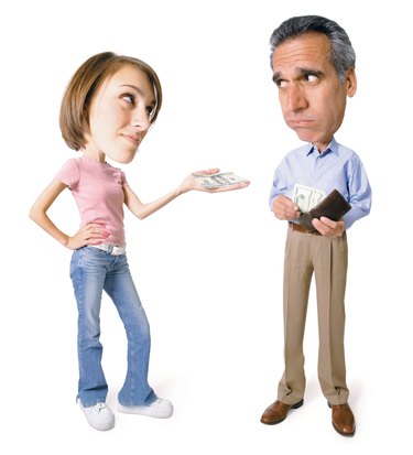 conceptual caricature of caucasian father as he gives money from his wallet to his teenage daughter