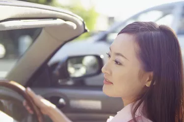 Young woman driving a car