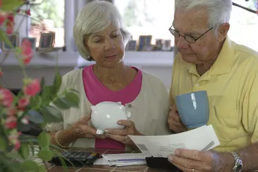 Close-up of a senior couple reading a bill