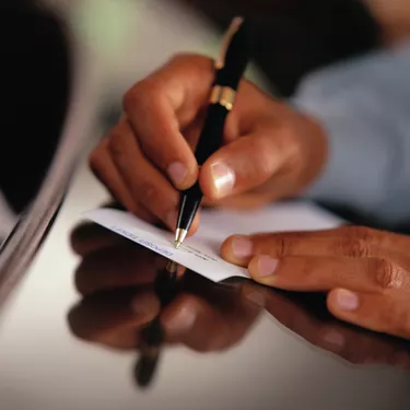 Man Filling out Deposit Slip