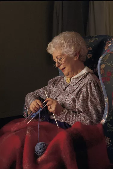 Elderly woman knitting