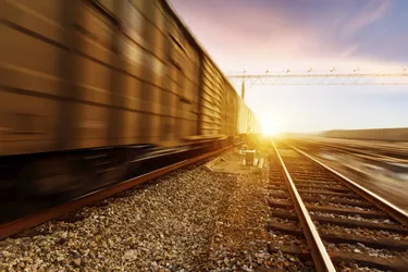 fast moving freight train, drawing out of the station