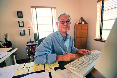 Man working on computer in home office