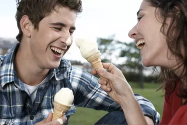 Couple playing with ice cream cones