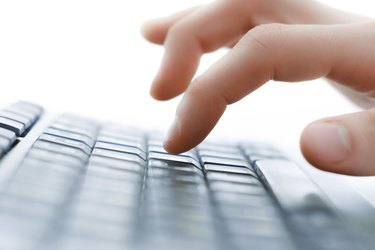 Image of man's hands typing. Selective focus